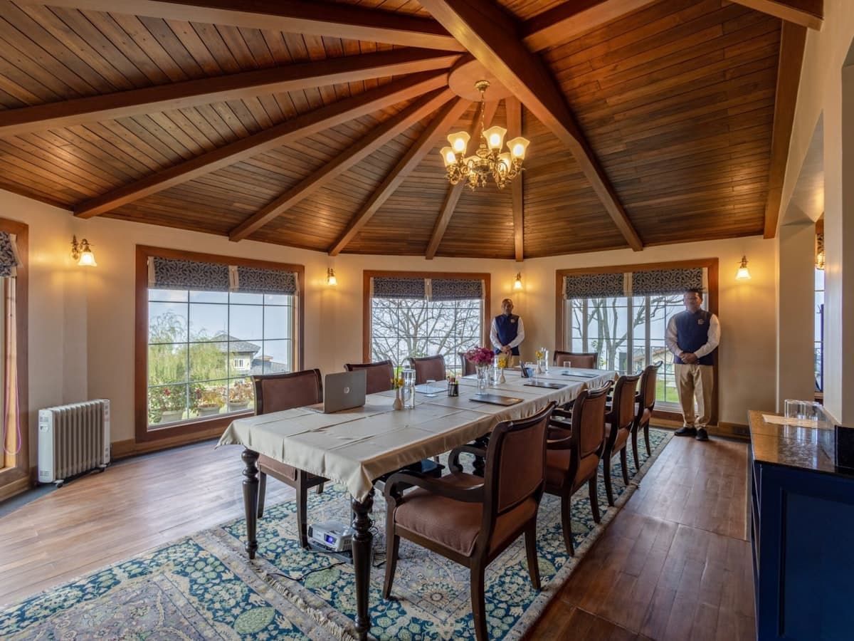 Elegant dining room with a long table and chairs. - EventGear PDX