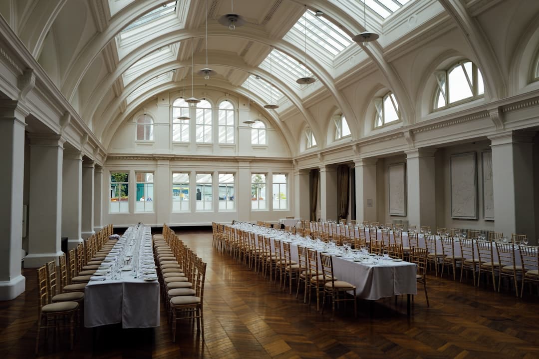 Corporate event setup with projector screen and PA system inside a banquet hall