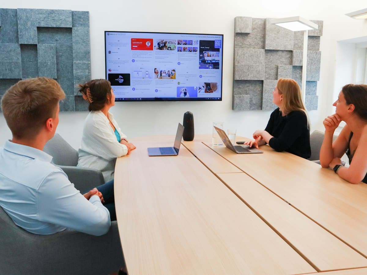 a group of people sitting around a conference table - EventGear PDX