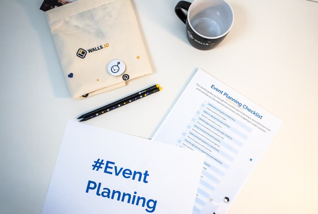 Event planner reviewing budget documents at a conference table with AV equipment in the background