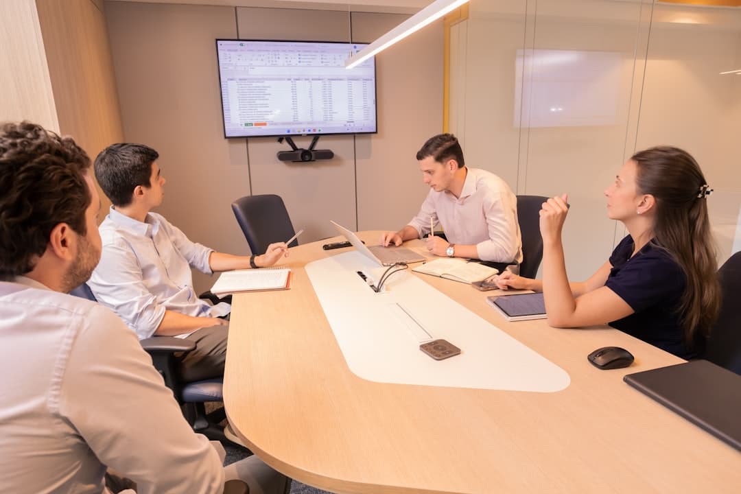 Corporate meeting room with projection screen and conference table setup