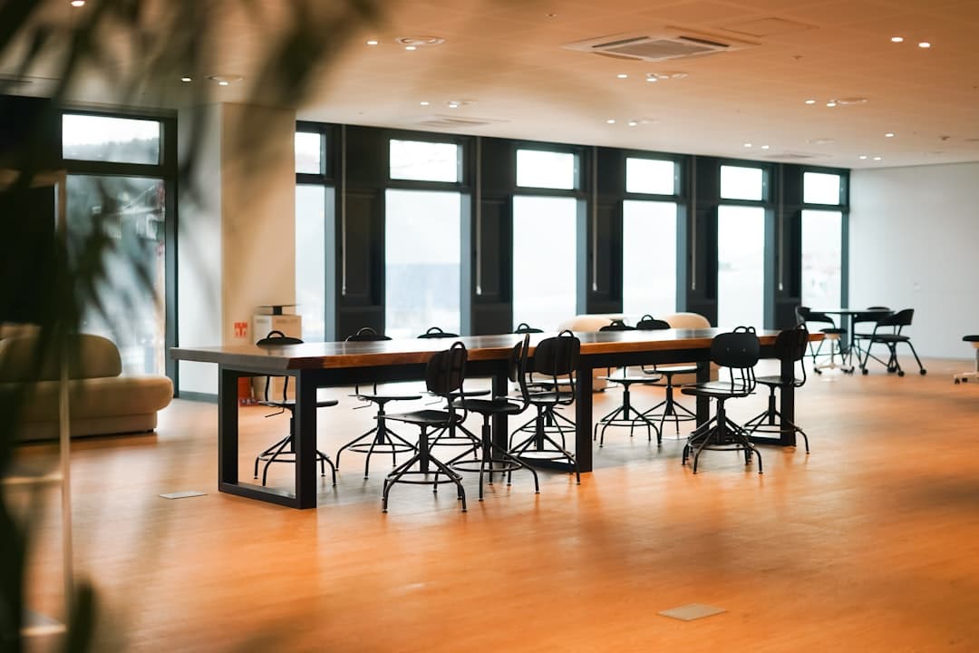 Corporate meeting room near an airport with presentation screen and conference table