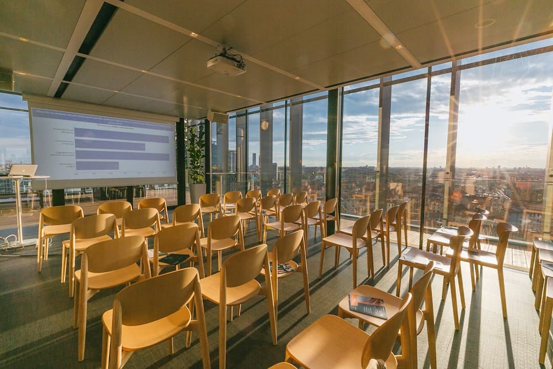 Projector and screen setup in a Portland conference room with rows of chairs