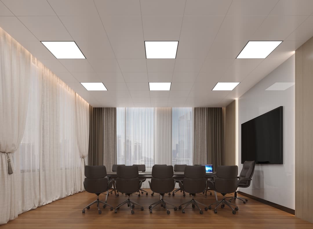 Corporate meeting room with projector screen and conference table in downtown Pittsburgh venue