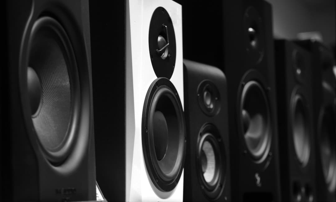 Professional PA speakers and microphone setup in a hotel ballroom event space