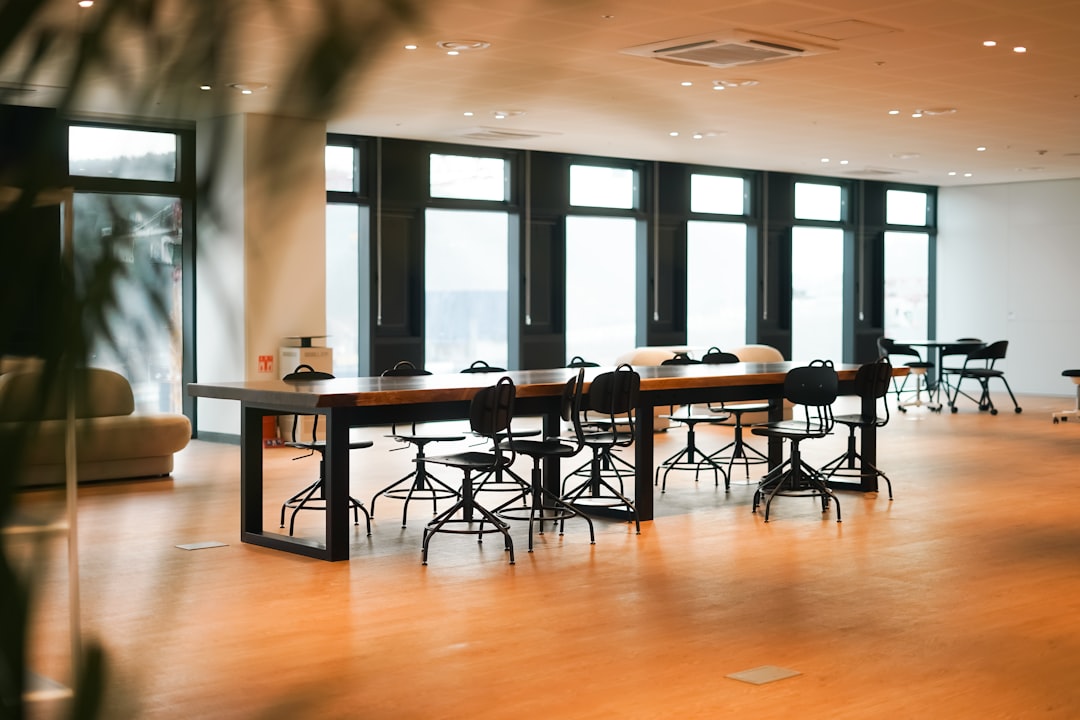 Corporate meeting room near an airport with presentation screen and conference table