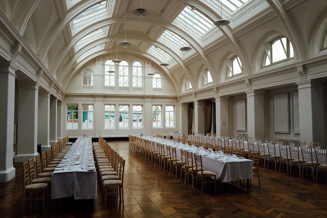 Corporate event setup with projector screen and PA system inside a banquet hall