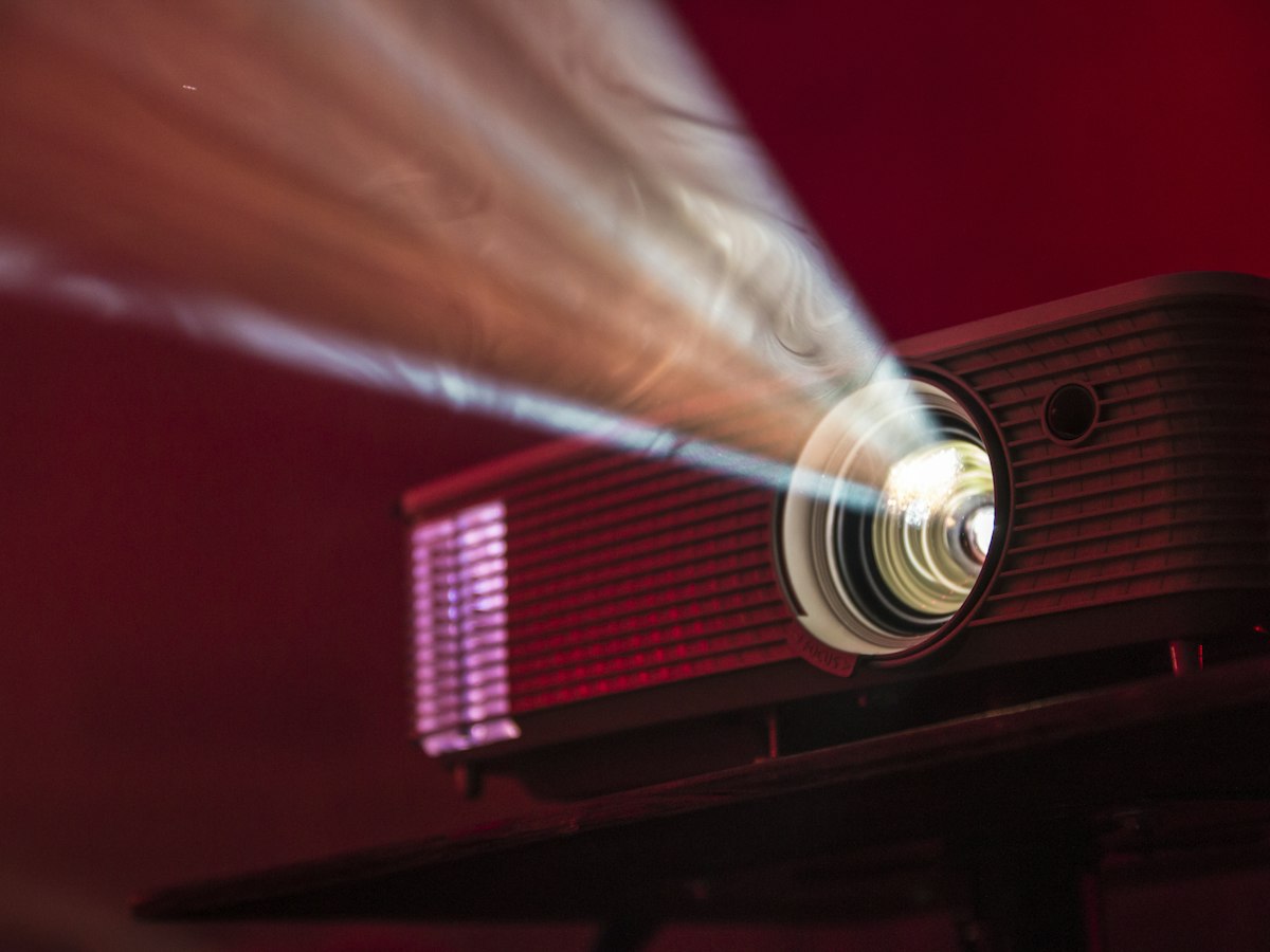 turned on LED projector on table - EventGear PDX